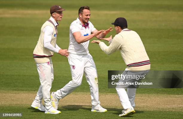 Josh Davey of Somerset celebrates the wicket of Rob Yates of Warwickshire with Tom Abell and Tom Banton during Day Two of the LV= Insurance County...