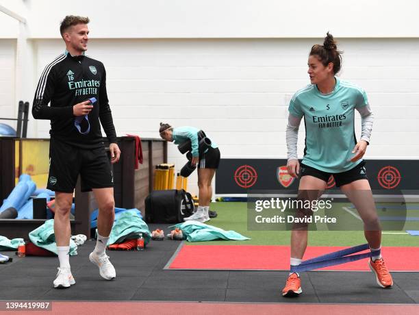 Rob Holding and Jennifer Beattie of Arsenal during the Arsenal Women's training session at London Colney on April 29, 2022 in St Albans, England.