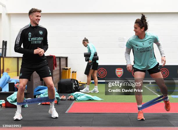 Rob Holding and Jennifer Beattie of Arsenal during the Arsenal Women's training session at London Colney on April 29, 2022 in St Albans, England.