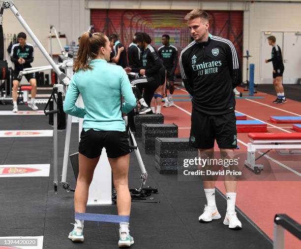 Rob Holding chats to Lia Walti of Arsenal during the Arsenal Women's training session at London Colney on April 29, 2022 in St Albans, England.