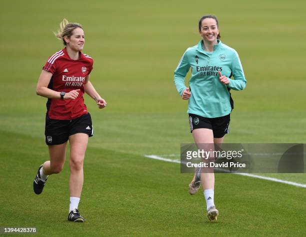 Anna Patten of Arsenal running with an Arsenal Women's Physio during the Arsenal Women's training session at London Colney on April 29, 2022 in St...