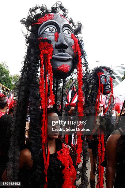 Members of Brian MacFarlane's dance during the band parade of Trinidad Carnival 2012 at Queen's Park Savannah on February 20, 2012 in Port of Spain,...
