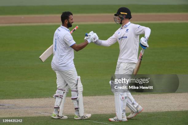 Cheteshwar Pujara of Sussex celebrates reaching his century with batting partner Tom Clark of Sussex during the LV= Insurance County Championship...