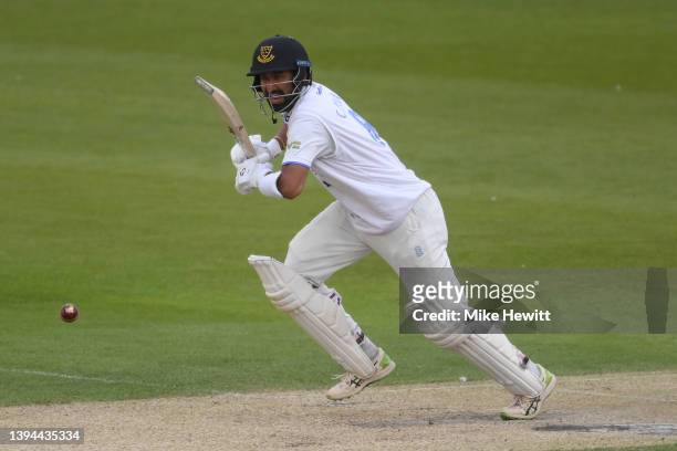 Cheteshwar Pujara of Sussex takes a quick single to reach his century during the LV= Insurance County Championship match between Sussex and Durham at...