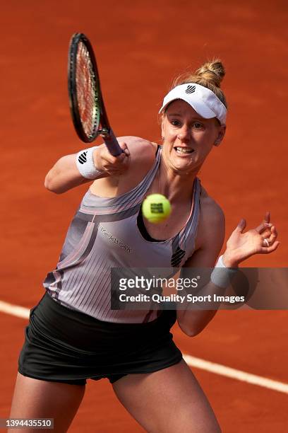 Alison Riske of USA returns a ball to Bianca Andreescu of Canada during Day Two of Mutua Madrid Open at La Caja Magica on April 29, 2022 in Madrid,...
