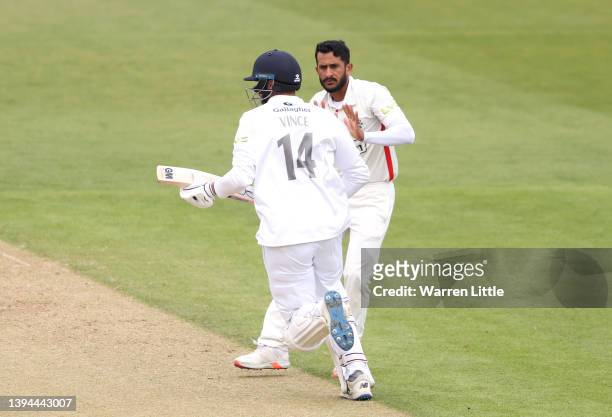 Hasan Ali of Lancashire steps out of the way as James Vince of Hampshire runs a single during the LV= Insurance County Championship match between...