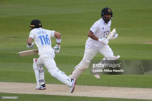 Cheteshwar Pujara and Mohammad Rizwan of Sussex take a quick single during the LV= Insurance County Championship match between Sussex and Durham at...