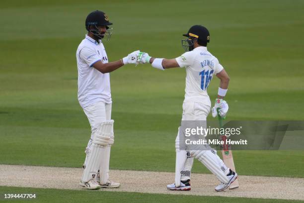 Cheteshwar Pujara and Mohammad Rizwan of Sussex fist pump during the LV= Insurance County Championship match between Sussex and Durham at The 1st...