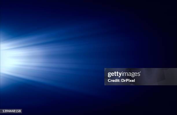 blue light rays on black background - ray stockfoto's en -beelden