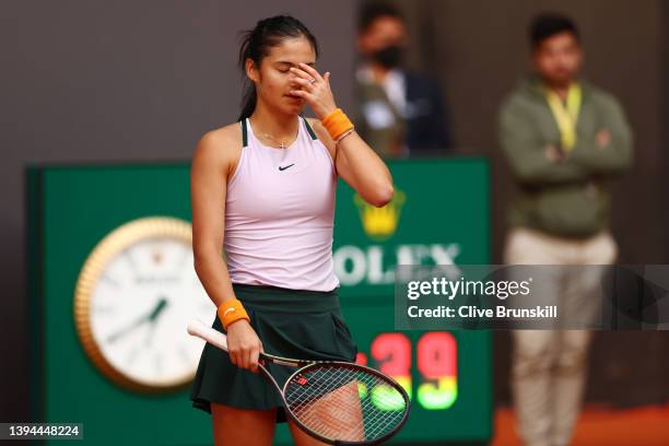 Emma Raducanu of Great Britain reacts in their first round match against Tereza Martincova of Czech Republic during day two of the Mutua Madrid Open...