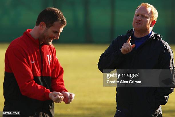 Head coach Heiko Vogel talks to Alexander Frei during a training session of FC Basel ahead of their UEFA Champions League Round of 16 first leg match...