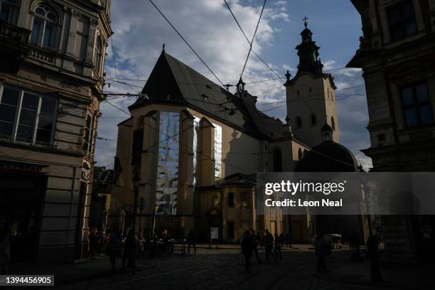 The Latynsʹkyy Katedralʹnyy Sobor, or "Latin Cathedral", is seen with protective metal sheets over the stained glass windows on April 30, 2022 in...