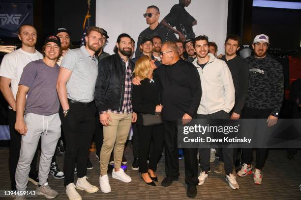 Apparel President & Executive Creative Director, Renee Parsons and PXG Founder & CEO, Bob Parsons pose for a photo with Philadelphia Flyers and Nate...