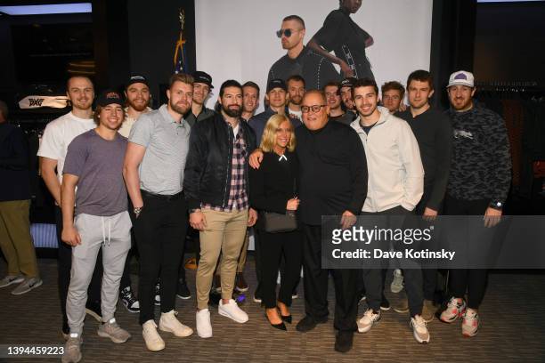 Apparel President & Executive Creative Director, Renee Parsons and PXG Founder & CEO, Bob Parsons pose for a photo with Philadelphia Flyers and Nate...