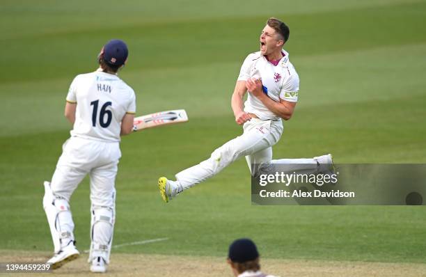 Tom Abell of Somerset celebrates taking the wicket of Sam Hain during Day Two of the LV= Insurance County Championship match between Somerset and...