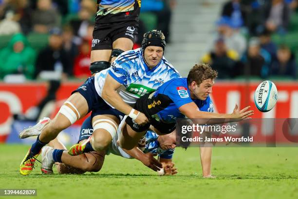 Kyle Godwin of the Force offloads the ball as he get taken to ground during the round 11 Super Rugby Pacific match between the Western Force and the...