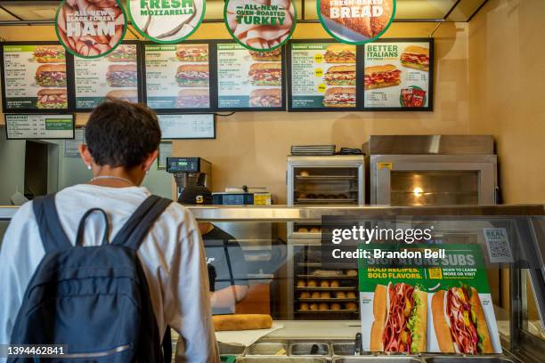 Customer waits to order food at a Subway fast-food restaurant on April 29, 2022 in Houston, Texas. The fast-food chain closed over 1,000 stores last...