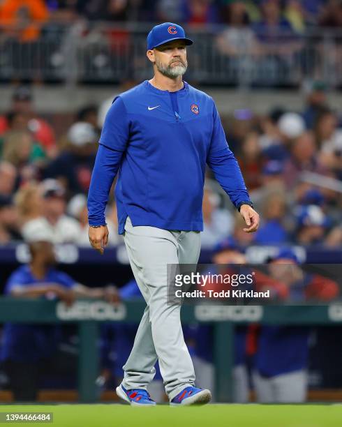 Manager, David Ross of the Chicago Cubs makes a pitching change during the seventh inning of an MLB game against the Atlanta Braves at Truist Park on...