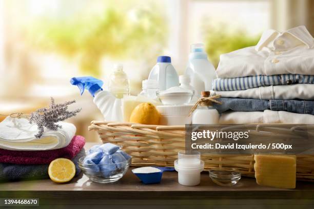 group of chemical and alternative laundry products on a table - aceto foto e immagini stock