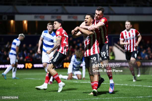 Iliman Ndiaye of Sheffield United celebrates with teammates Jack Robinson and Morgan Gibbs-White after scoring their team's first goal during the Sky...