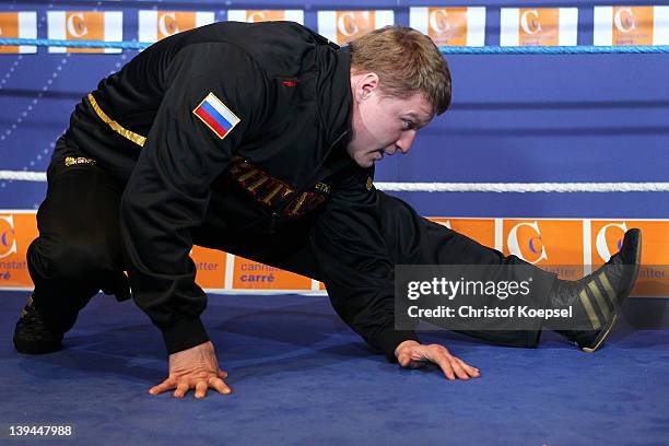 Alexander Povetkin of Russia stretches during the public training at Canstatter Carre on February 21, 2012 in Stuttgart, Germany. The WBA World...