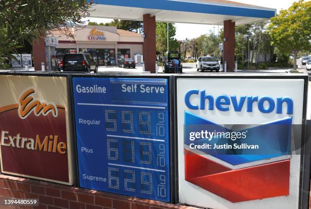 Sign is posted in front of a Chevron gas station on April 29, 2022 in Greenbrae, California. Chevron reported first quarter earnings that surged to...