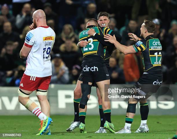 James Grayson of Northampton Saints, who kicked a late match winning penalty, celebrates with team mates Ollie Sleightholme and Rory Hutchinson after...