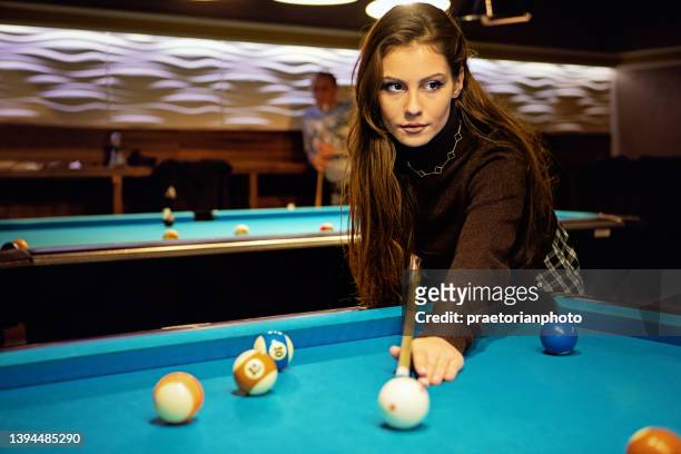 portrait of young woman playing billiard - disco ball bildbanksfoton och bilder