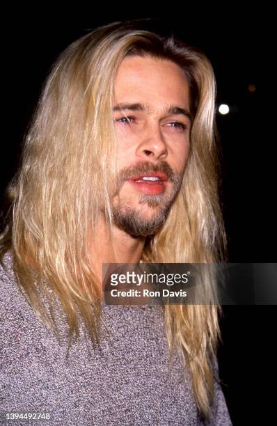 American actor and film producer Brad Pitt, attends the "Legends of the Fall" Los Angeles Premiere on November 30, 1994 at the Mann Village Theatre...