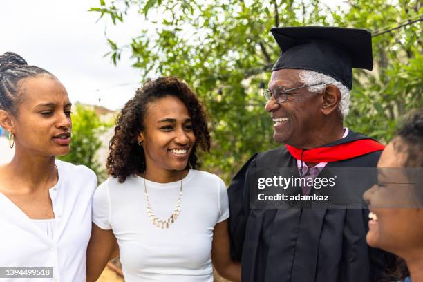 family laughing after the father's graduation - military intelligence stock pictures, royalty-free photos & images