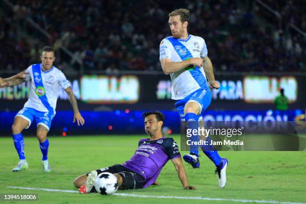 Oswaldo Alanis of Mazatlan fights for the ball with Fernando Aristeguieta of Puebla during the 17th round match between Mazatlan FC and Puebla as...