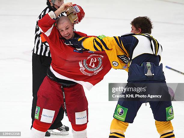 Ivan Vishnevsky of the Atlant and Jon Mirasty of the Vityaz tangled up as they fight during the game between Vityaz Chekhov and Atlant Moscow region...