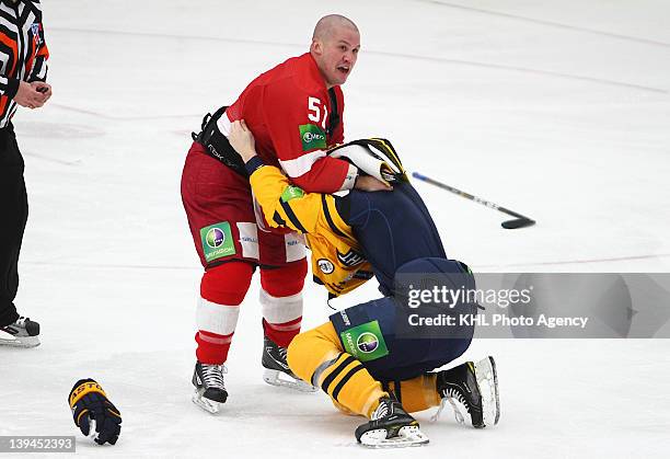 Ivan Vishnevsky of the Atlant and Jon Mirasty of the Vityaz get tangled up as they fight during the game between Vityaz Chekhov and Atlant Moscow...