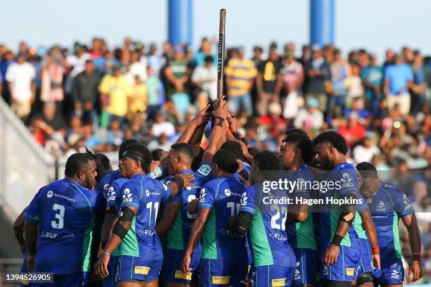 Fijian Drua players form a huddle during the round 11 Super Rugby Pacific match between the Fijian Drua and the Highlanders at ANZ Stadium on April...