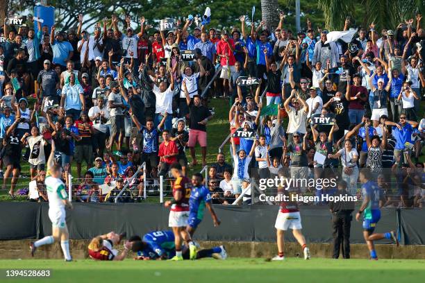 Fans celebrate a Fijian Drua try during the round 11 Super Rugby Pacific match between the Fijian Drua and the Highlanders at ANZ Stadium on April...