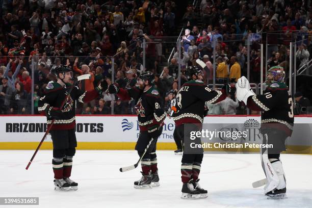 Goaltender Harri Sateri of the Arizona Coyotes is congratulated by Nick Schmaltz after defeating the Nashville Predators in the NHL game at Gila...