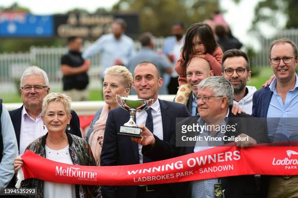 Trainer Nick Ryan poses with connections after Regardsmaree wo Race 8, the Ladbrokes Anniversary Vase during, Melbourne Racing at Sandown Hillside on...