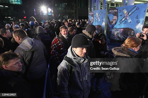 Several hundred people wait to be among the first to buy the new Sony PlayStation Vita portable gaming device outside the Sony Store during the...