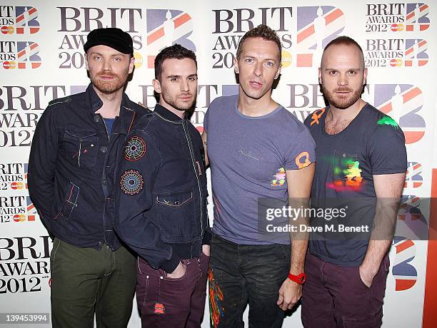 Jonny Buckland, Guy Berryman, Chris Martin and Will Champion of Coldplay arrive at the BRIT Awards 2012 at O2 Arena on February 21, 2012 in London,...