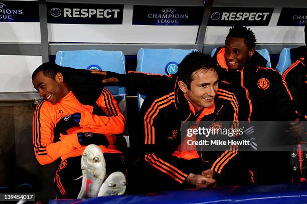 Chelsea substitutes Ashley Cole, Frank Lampard and John Obi Mikel look on from the dugout during the UEFA Champions League round of 16 first leg...