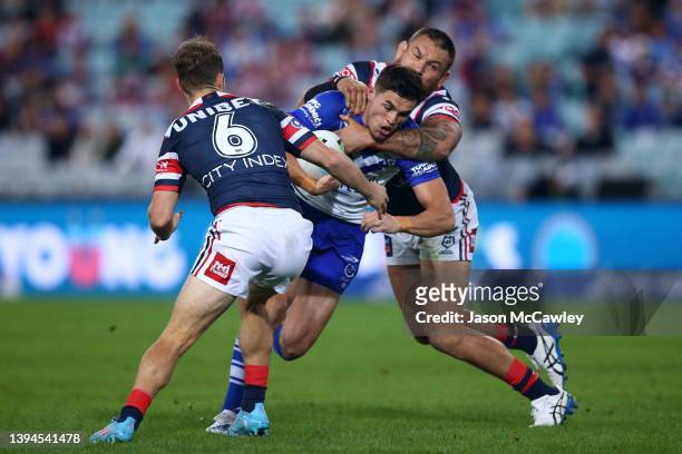 Kyle Flanagan of the Bulldogs is tackled during the round eight NRL match between the Canterbury Bulldogs and the Sydney Roosters at Stadium...
