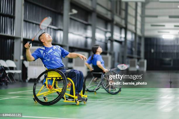 handicapped badminton players actively training their skills - badminton sport stock pictures, royalty-free photos & images