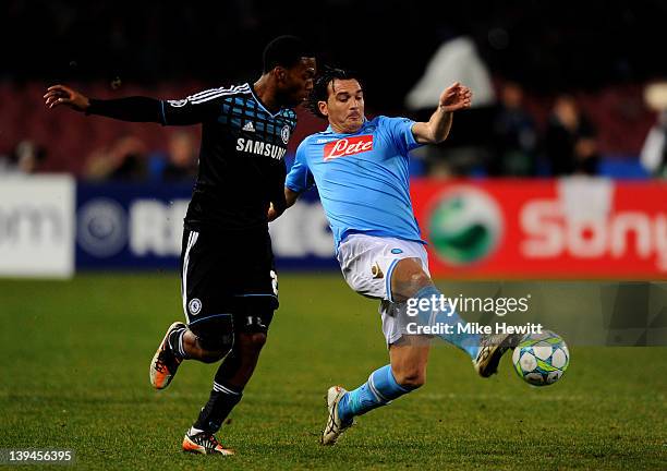 Salvatore Aronica of Napoli controls the ball under pressure from Daniel Sturridge of Chelsea during the UEFA Champions League round of 16 first leg...