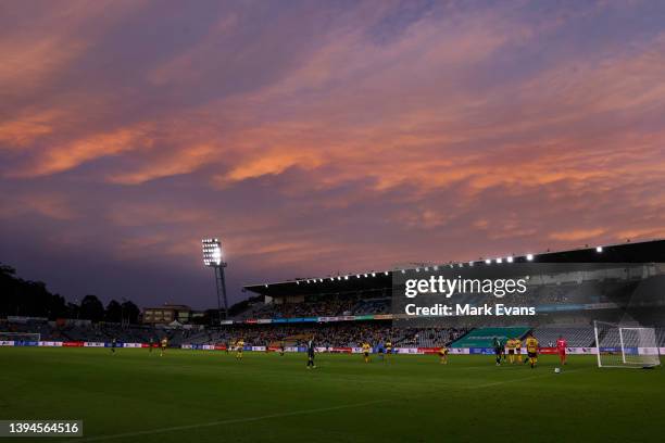 The sun sets during play in the A-League mens match between Central Coast Mariners and Western United at Central Coast Stadium, on April 30 in...