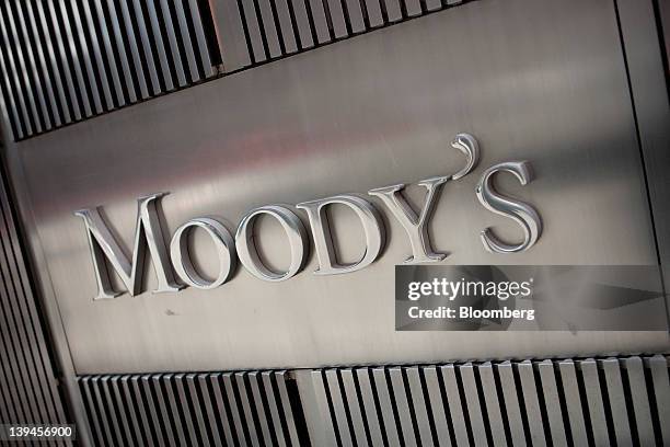 The Moody's Investors Service Inc. Logo is displayed outside of the company's headquarters in New York, U.S., on Tuesday, Feb. 21, 2012. Moody's...