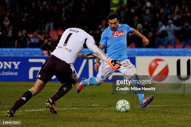 Ezequiel Lavezzi of Napoli shoots past Petr Cech of Chelsea to score his team's third goal during the UEFA Champions League round of 16 first leg...