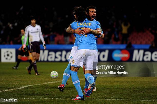 Ezequiel Lavezzi of Napoli celebrates with teammate Edinson Cavani after scoring his team's third goal during the UEFA Champions League round of 16...