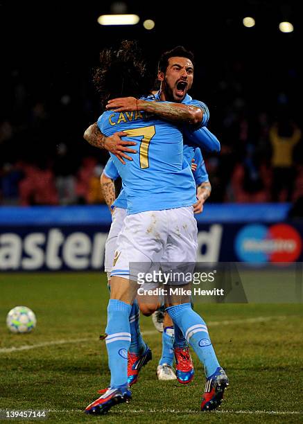 Ezequiel Lavezzi of Napoli celebrates with teammate Edinson Cavani after scoring his team's third goal during the UEFA Champions League round of 16...