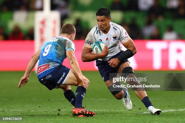 Mike Curry of Moana Pasifika runs at James Tuttle of the Rebels during the round 11 Super Rugby Pacific match between the Melbourne Rebels and the...