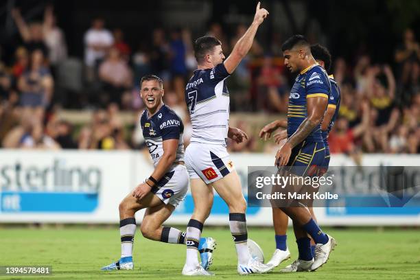 Scott Drinkwater of the Cowboys celebrates with his team mate Chad Townsend of the Cowboys after scoring a try during the round eight NRL match...